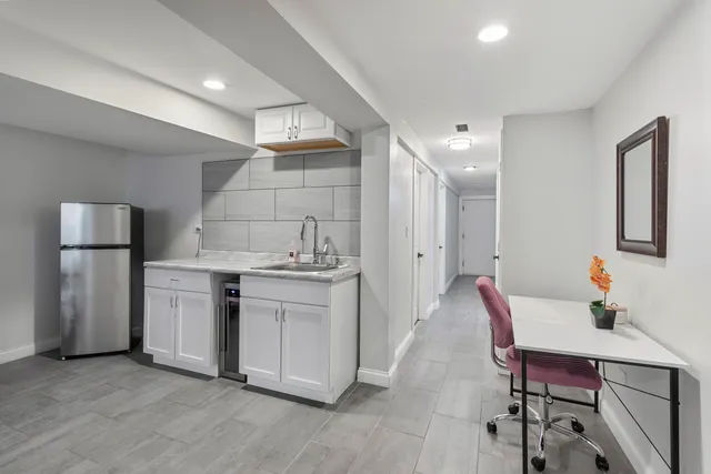 a kitchen with a sink cabinets and appliances