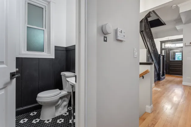 a bathroom with a toilet and a shower