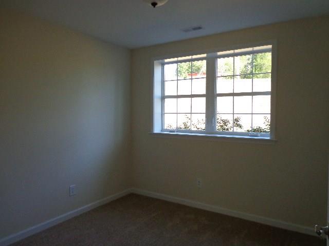 1459 Cliff Amos Road Spring Hill, TN 37174 - Photo 22 of 24 an empty room with a window