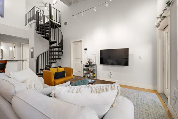 a living room with furniture and a flat screen tv