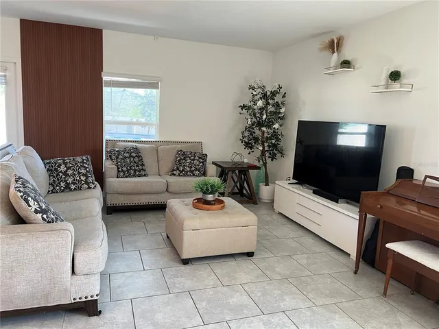 a kitchen with a refrigerator stove and white cabinets
