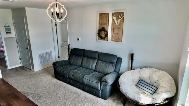 a bedroom with a bed and a night stand