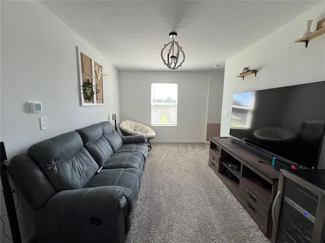 a bathroom with a shower and a glass door