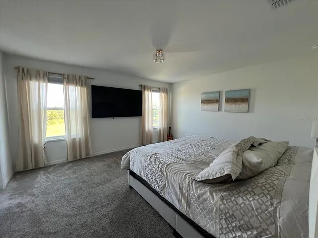 a view of a bathroom with a sink and a mirror