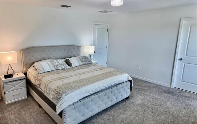 a bedroom with furniture and a window