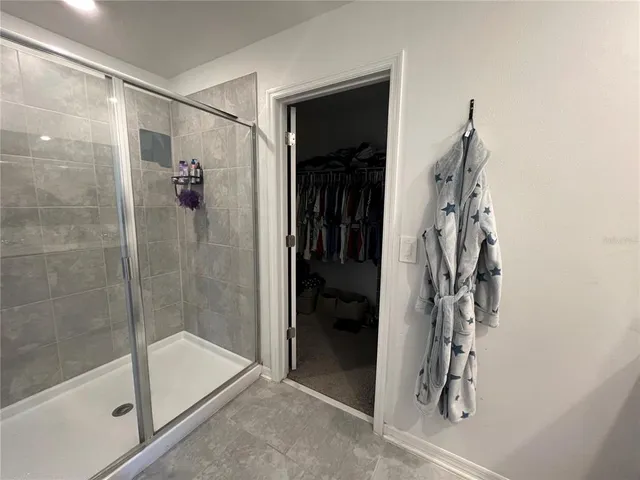 a view of a room with furniture and a window