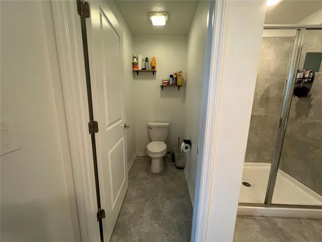 a bed room with a bed and a window