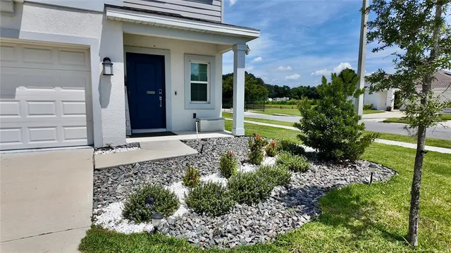 a lobby with furniture and floor to ceiling window