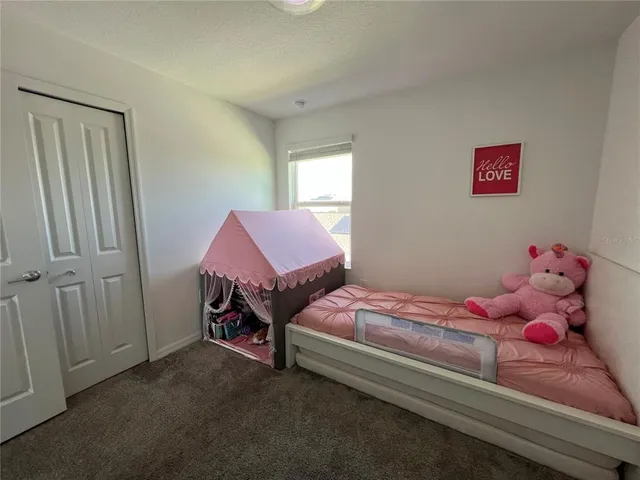 a view of a workspace with furniture and wooden floor