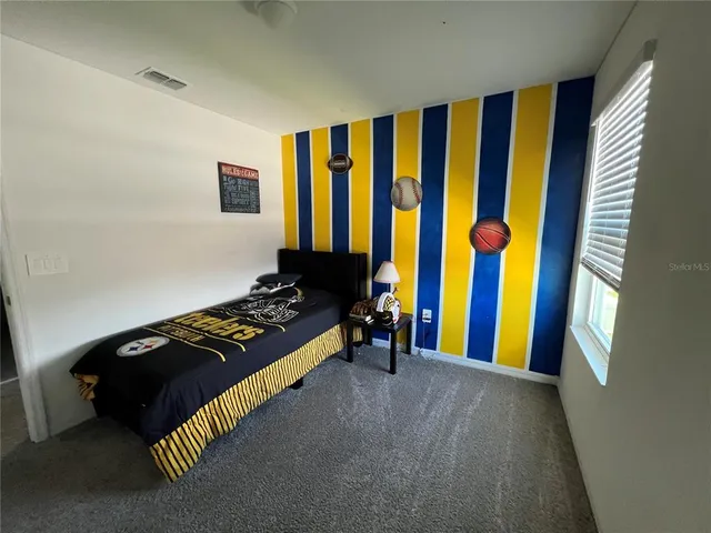 a view of a workspace with furniture and a workspace