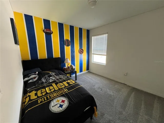 a view of backyard with small cabin