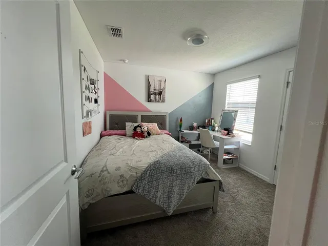 a swimming pool with some trees in the background