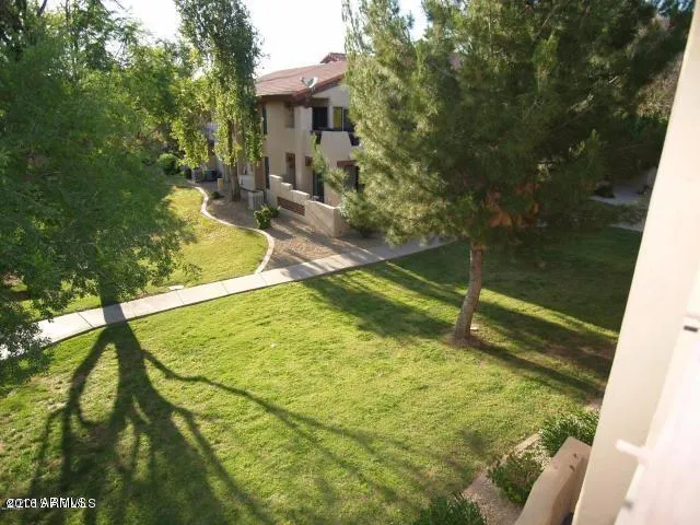 a swimming pool with outdoor seating and yard
