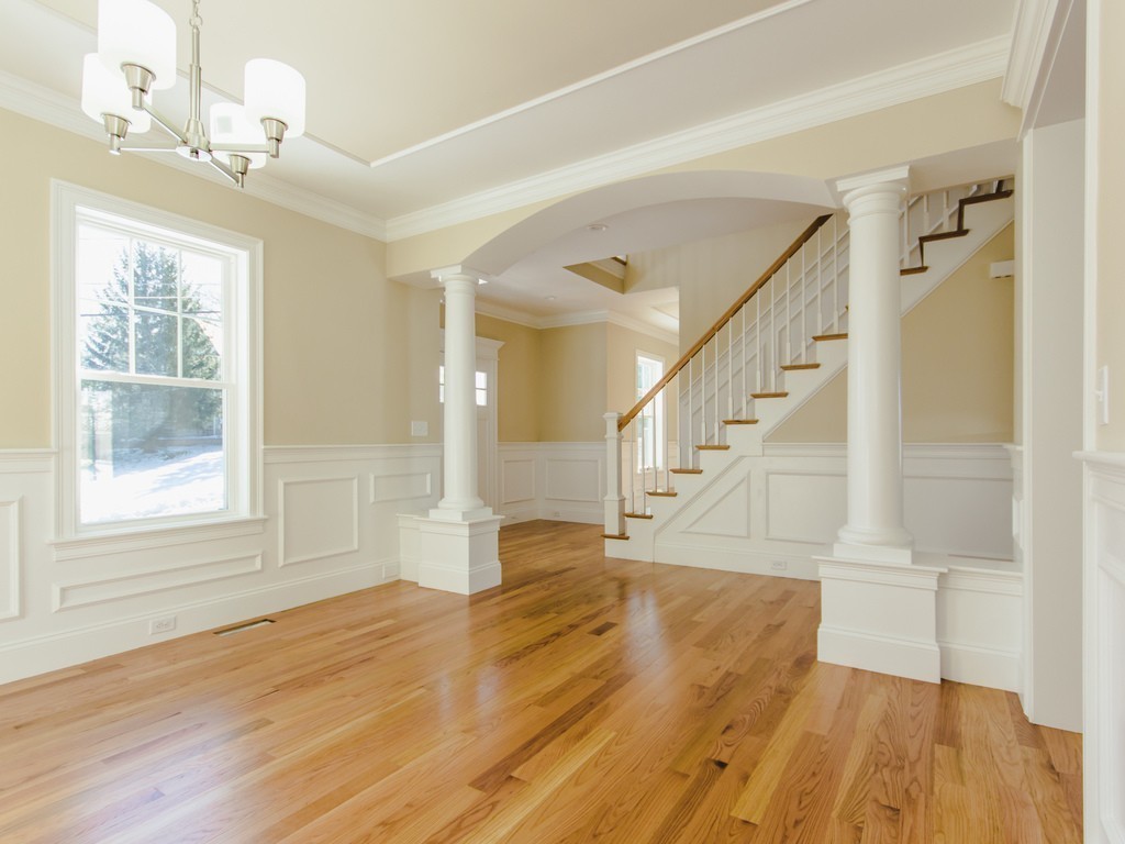 6 Lee Road Needham, MA 02494 - Photo 6 of 10 a view of empty room with wooden floor and fan