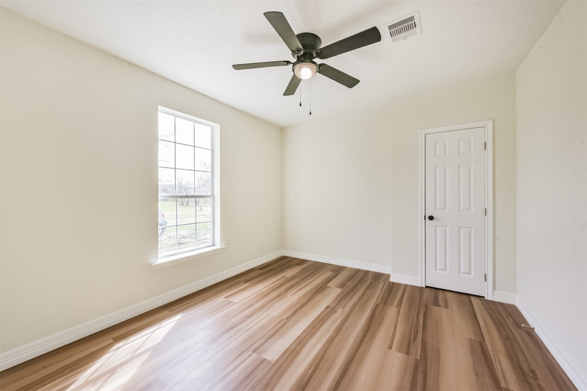 2619 Bellview Street La Marque, TX 77568 - Photo 30 of 46 wooden floor in an empty room with a window