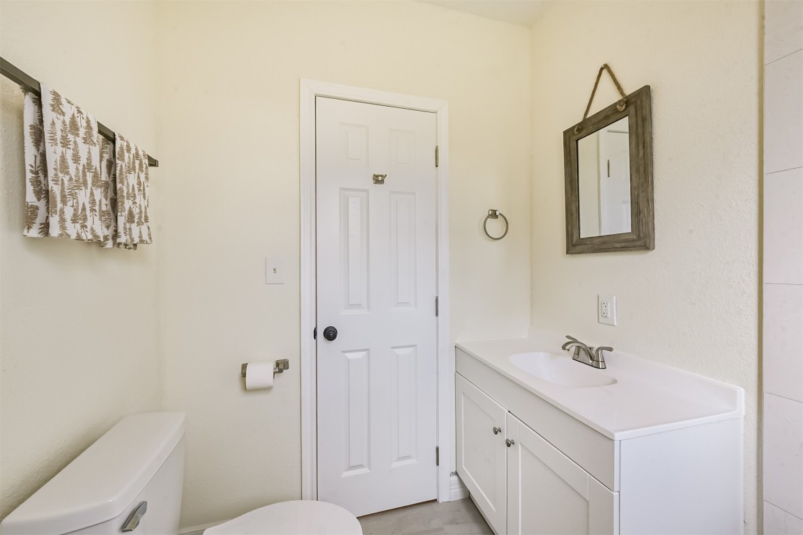 2619 Bellview Street La Marque, TX 77568 - Photo 34 of 46 a bathroom with a sink and a mirror