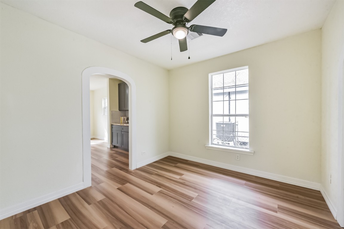 2619 Bellview Street La Marque, TX 77568 - Photo 9 of 46 a view of an empty room with window and wooden floor