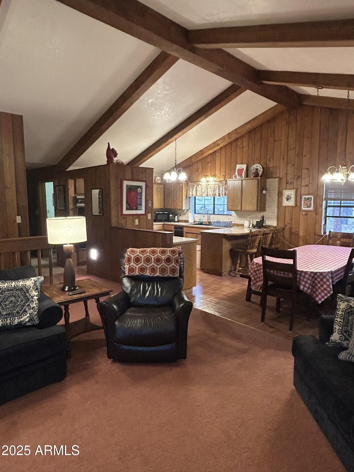 3 County Road Greer, AZ 85927 - Photo 21 of 65 a living room with furniture window and a table