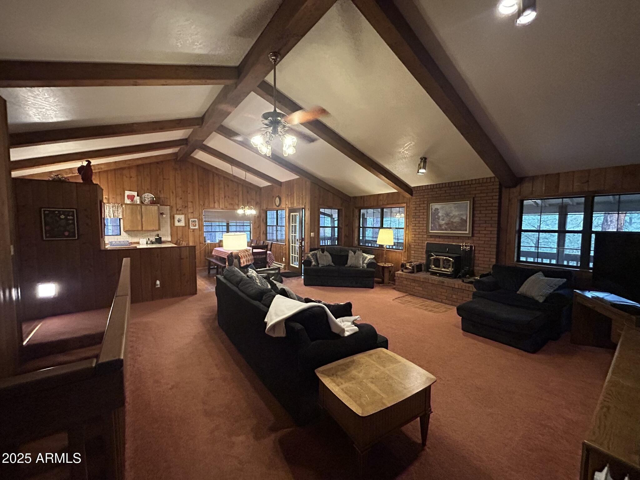 3 County Road Greer, AZ 85927 - Photo 37 of 65 a living room with furniture and a large window
