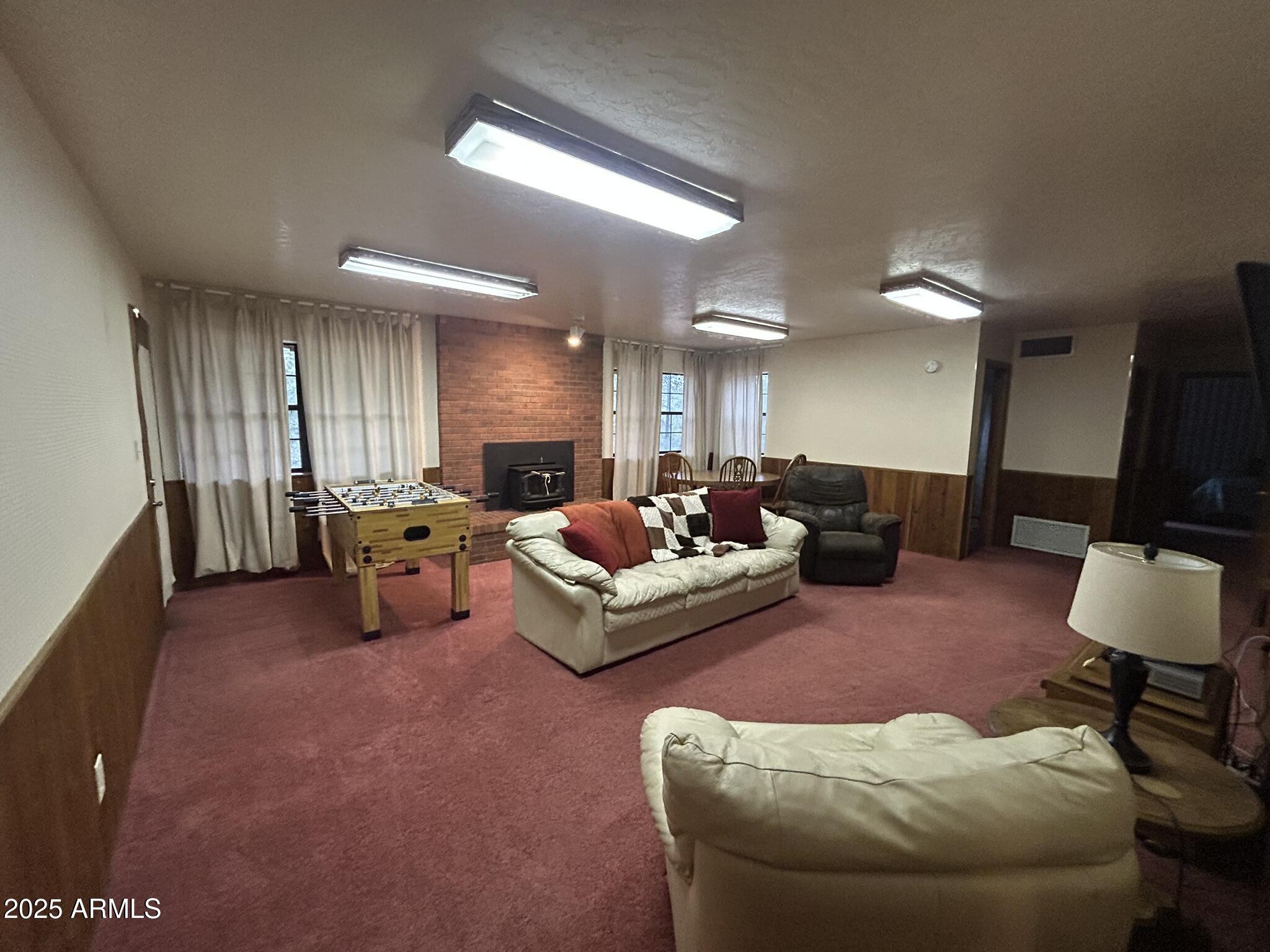 3 County Road Greer, AZ 85927 - Photo 45 of 65 a living room with furniture and a lamp