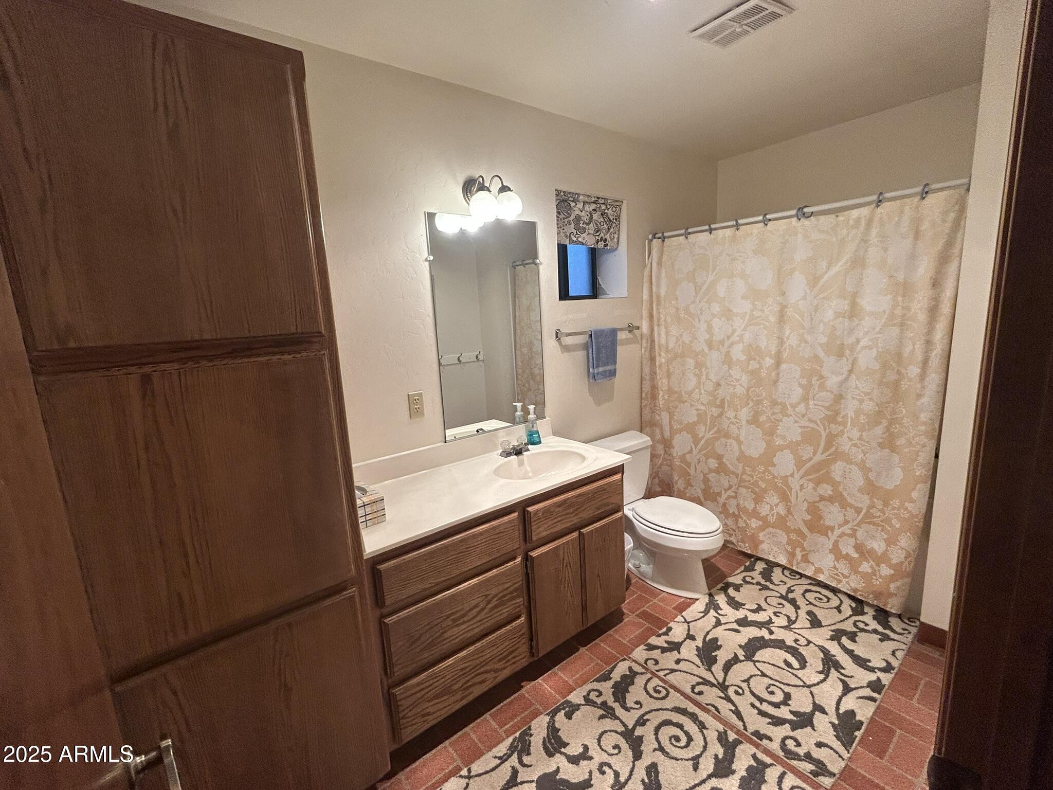 3 County Road Greer, AZ 85927 - Photo 50 of 65 a bathroom with a sink toilet and shower
