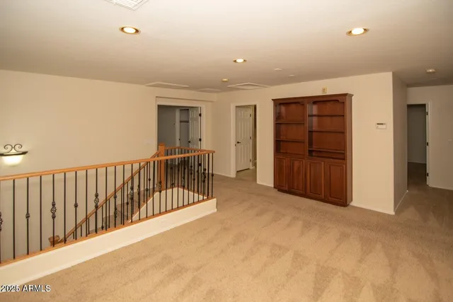 a view of an empty room with furniture