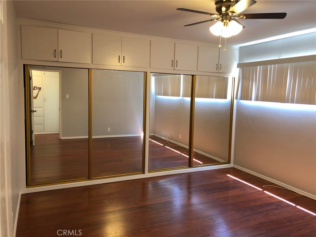 307 Cherry Avenue, Unit 5 Long Beach, CA 90802 - Photo 15 of 20 a kitchen with granite countertop a refrigerator a sink and a window