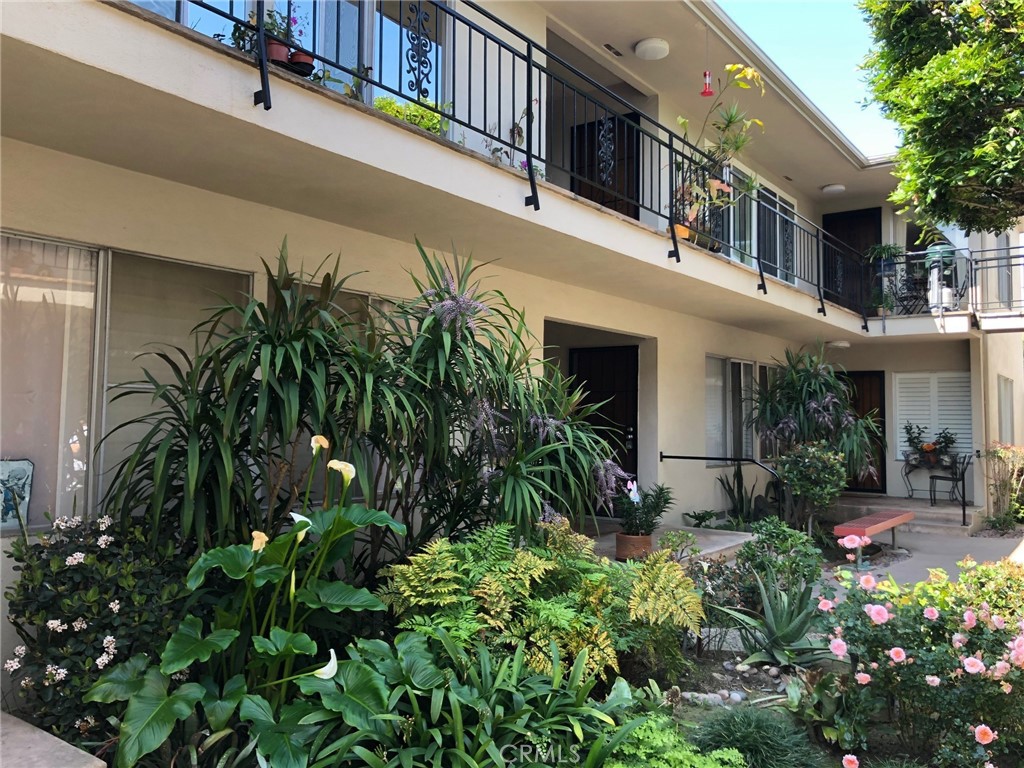 307 Cherry Avenue, Unit 5 Long Beach, CA 90802 - Photo 4 of 20 a view of a house with a flower garden