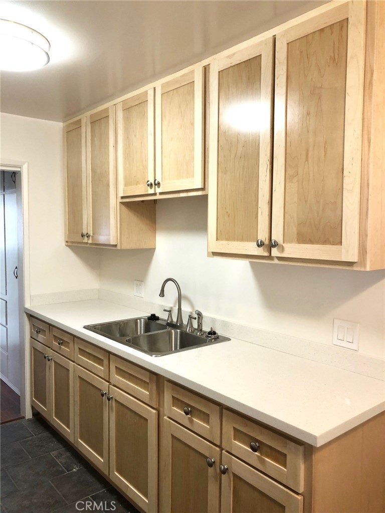 307 Cherry Avenue, Unit 5 Long Beach, CA 90802 - Photo 10 of 20 a kitchen with a sink and cabinets
