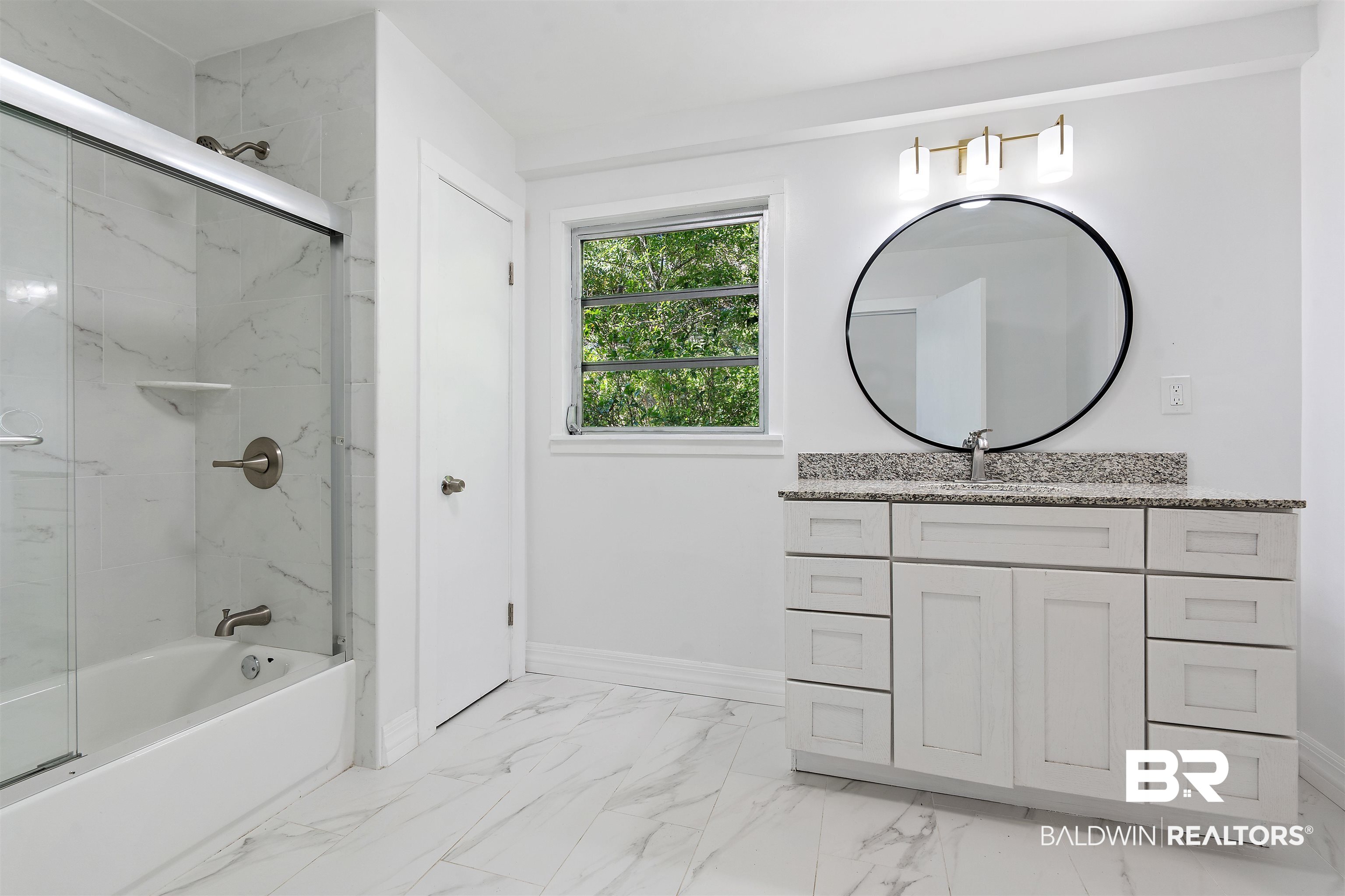 407 East 2nd Street Bay Minette, AL 36507 - Photo 20 of 40 Full bath featuring enclosed tub / shower combo, vanity, and light marble finish floors