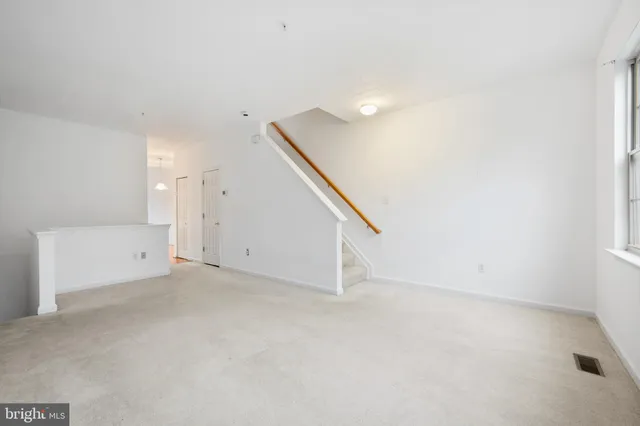 a view of an empty room with white walls