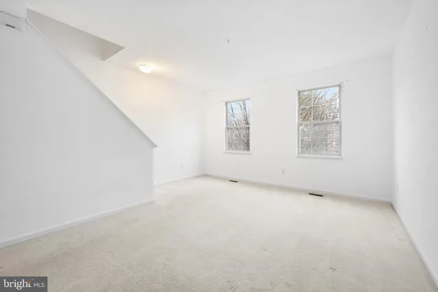 an empty room with windows