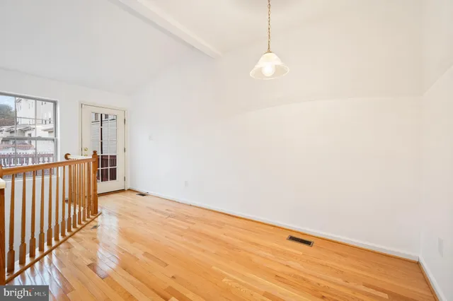a view of a livingroom with wooden floor