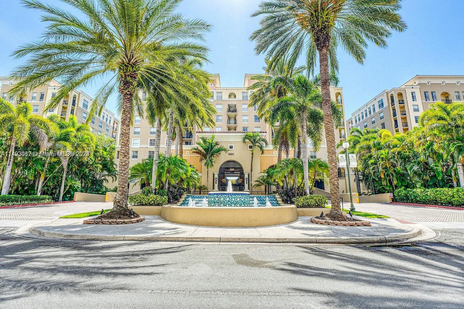 a view of a building with a palm tree