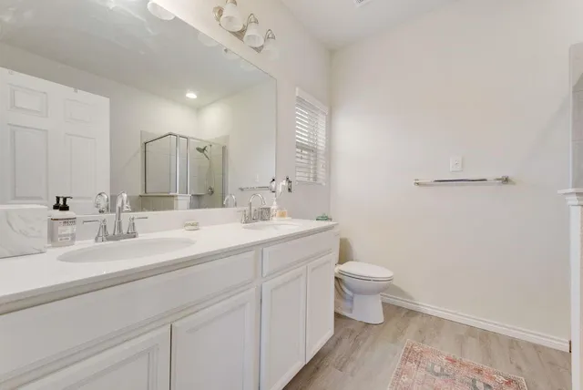 a bedroom with a bed and a table