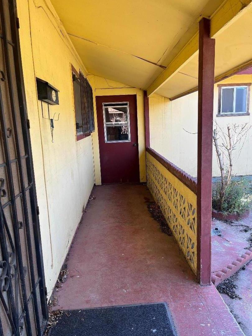306 Maya Circle Soledad, CA 93960 - Photo 4 of 16 a view of a porch with wooden floor and iron stairs