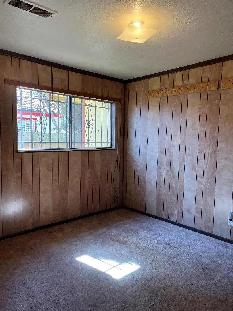 306 Maya Circle Soledad, CA 93960 - Photo 9 of 16 an empty room with a window and doors