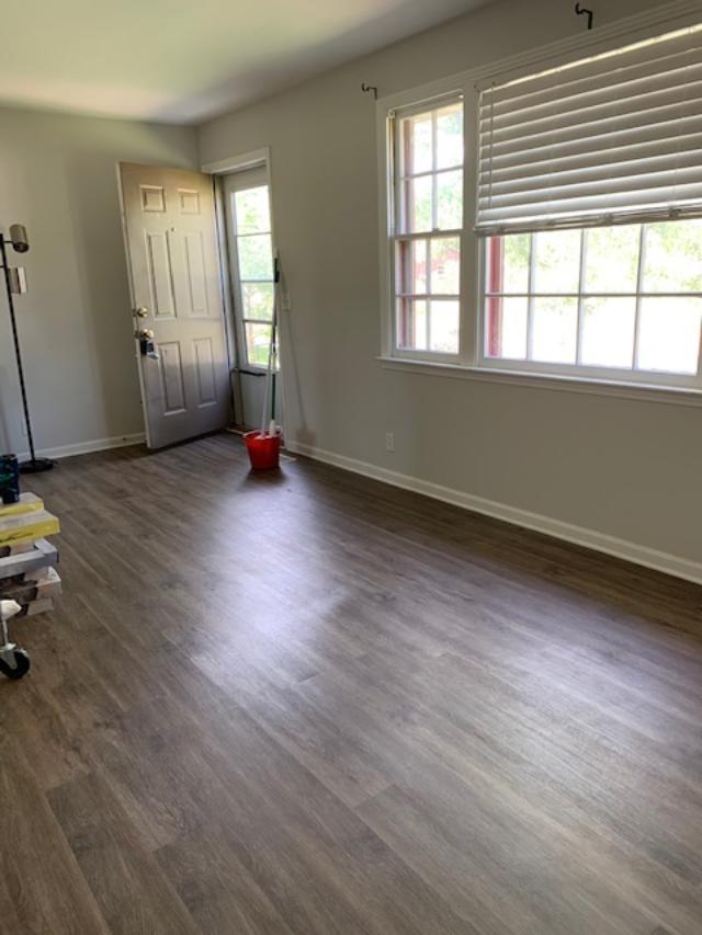 413 Cedarcliff Road Antioch, TN 37013 - Photo 3 of 12 an empty room with wooden floor and windows