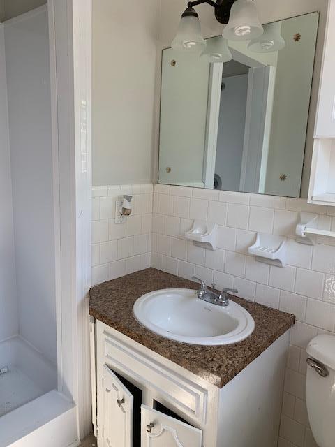 413 Cedarcliff Road Antioch, TN 37013 - Photo 7 of 12 a bathroom with a sink and a mirror