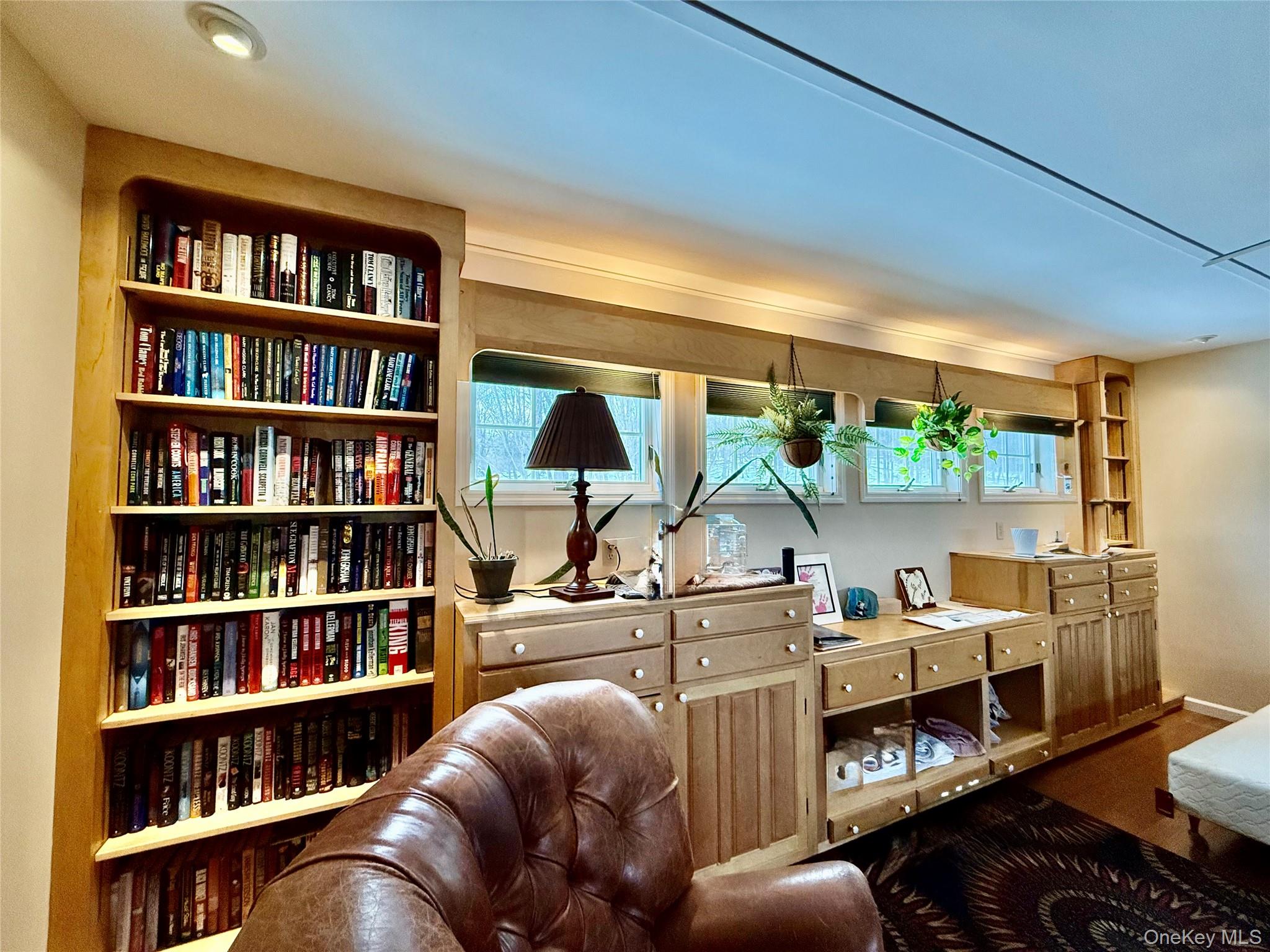 912-918 Hollow Road Salt Point, NY 12578 - Photo 15 of 35 a living room with furniture and a book shelf