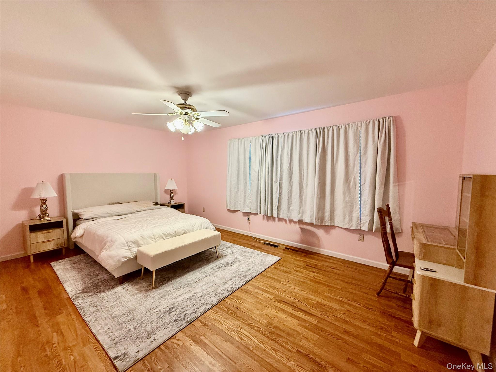 912-918 Hollow Road Salt Point, NY 12578 - Photo 17 of 35 a bedroom with a bed and wooden floor
