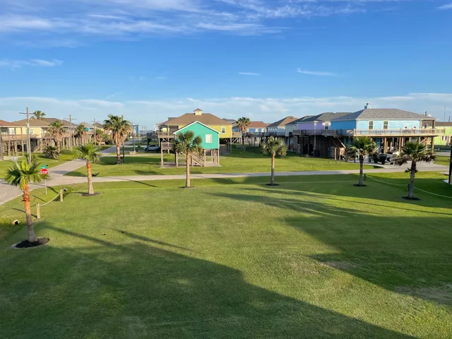 a view of a big building with yard