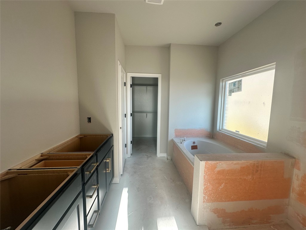 1800 Davee Place Georgetown, TX 78633 - Photo 16 of 32 a hallway with a sink and cabinets