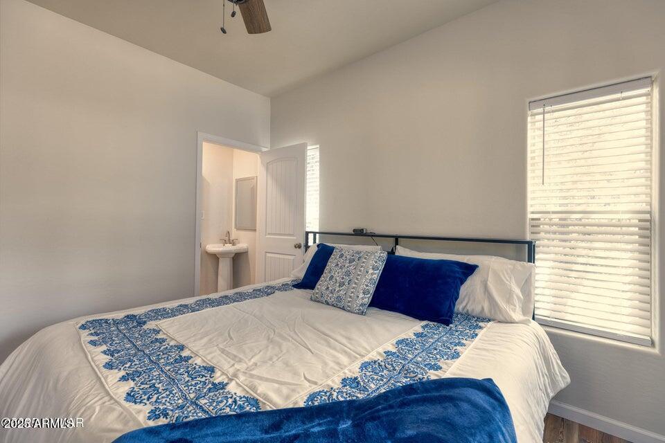 2145 Cottontail Road Overgaard, AZ 85933 - Photo 14 of 22 a bedroom with a bed and window