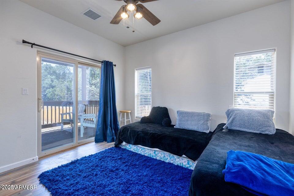 2145 Cottontail Road Overgaard, AZ 85933 - Photo 16 of 22 a living room with furniture and a window