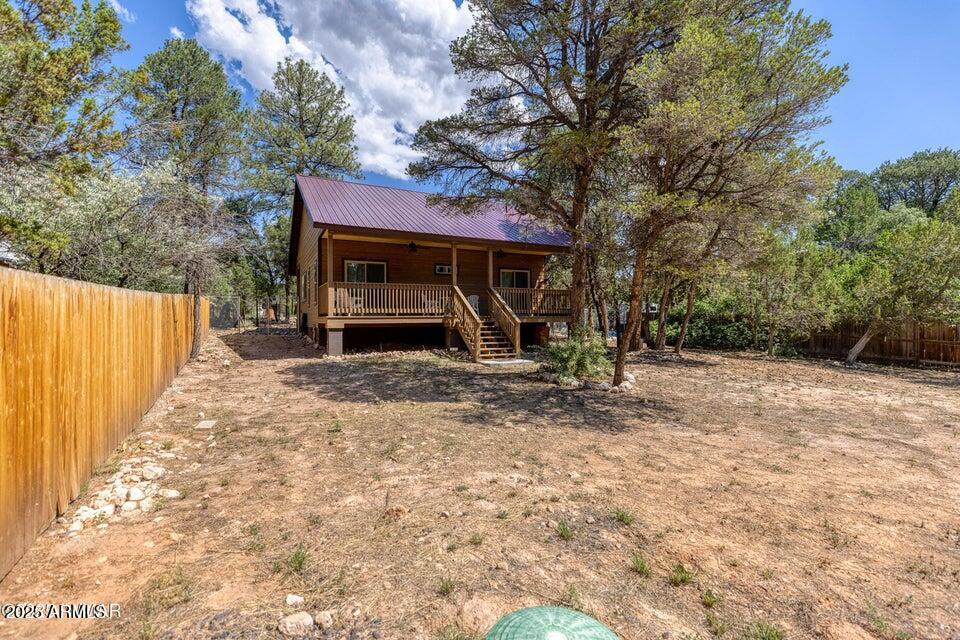 2145 Cottontail Road Overgaard, AZ 85933 - Photo 18 of 22 a view of a house with a yard
