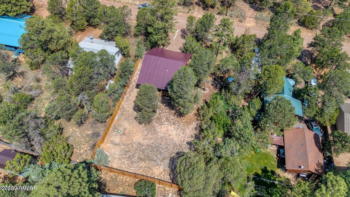 2145 Cottontail Road Overgaard, AZ 85933 - Photo 20 of 22 an aerial view of a house with a yard