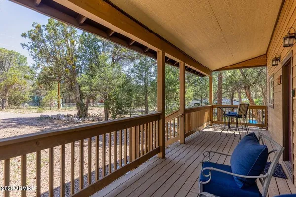 a view of balcony with wooden floor