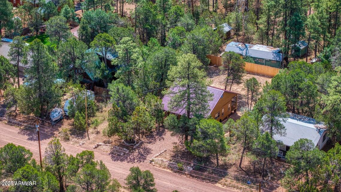 2145 Cottontail Road Overgaard, AZ 85933 - Photo 6 of 22 an aerial view of a house with a yard and trees all around