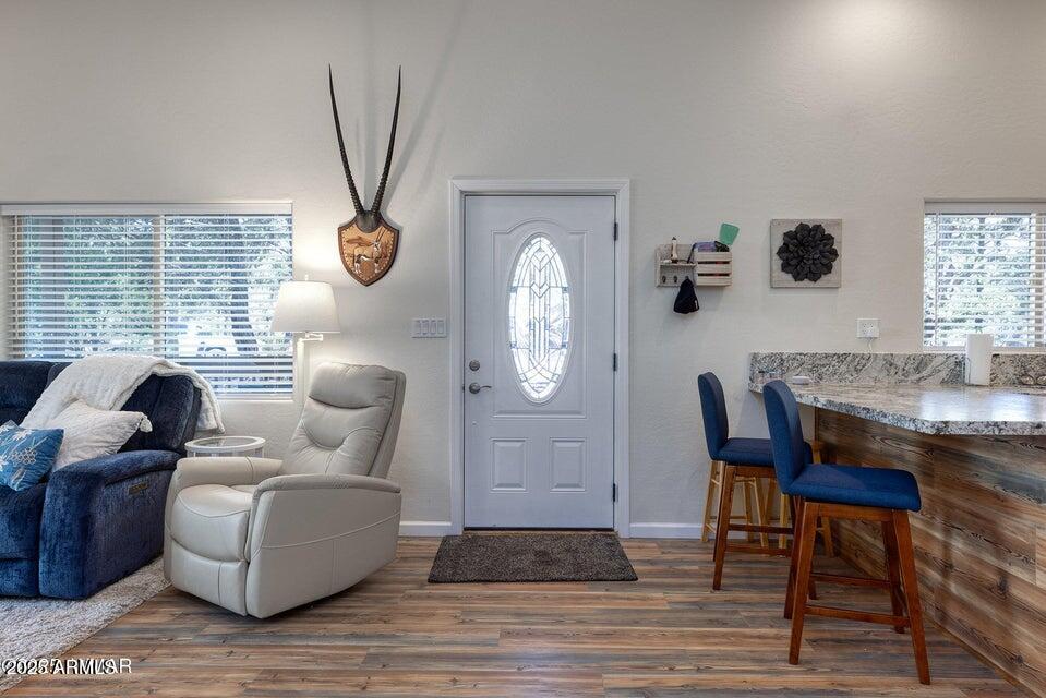 2145 Cottontail Road Overgaard, AZ 85933 - Photo 7 of 22 a living room with furniture and a large window